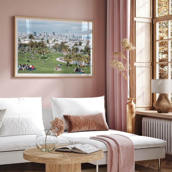 A fine art unframed or framed San Francisco print of Mission Dolores Park showcasing picnic blankets and people enjoying a quiet afternoon with the city skyline in the backdrop.