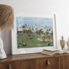 A fine art unframed or framed San Francisco print of Mission Dolores Park showcasing picnic blankets and people enjoying a quiet afternoon with the city skyline in the backdrop.
