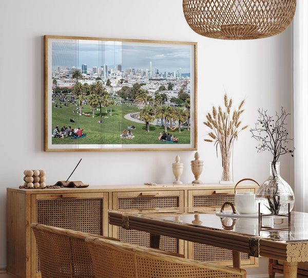 A fine art unframed or framed San Francisco print of Mission Dolores Park showcasing picnic blankets and people enjoying a quiet afternoon with the city skyline in the backdrop.