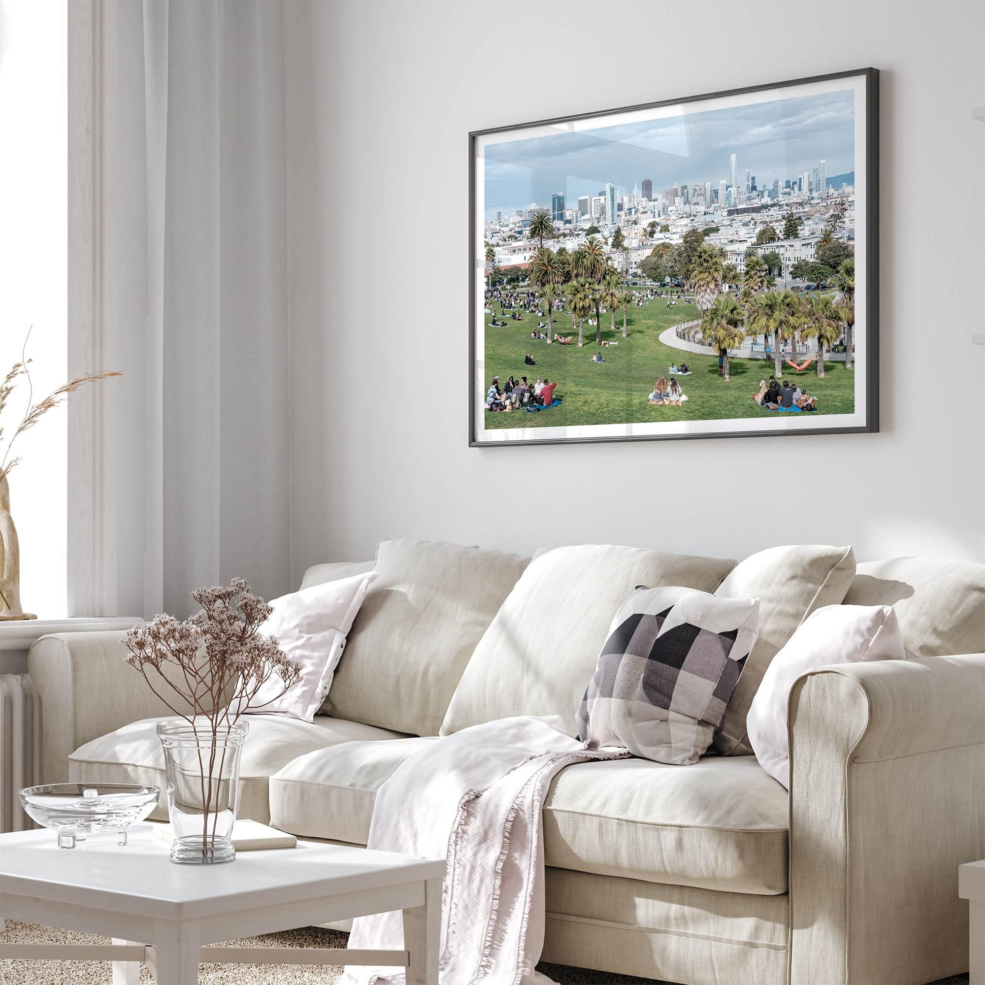 A fine art unframed or framed San Francisco print of Mission Dolores Park showcasing picnic blankets and people enjoying a quiet afternoon with the city skyline in the backdrop.