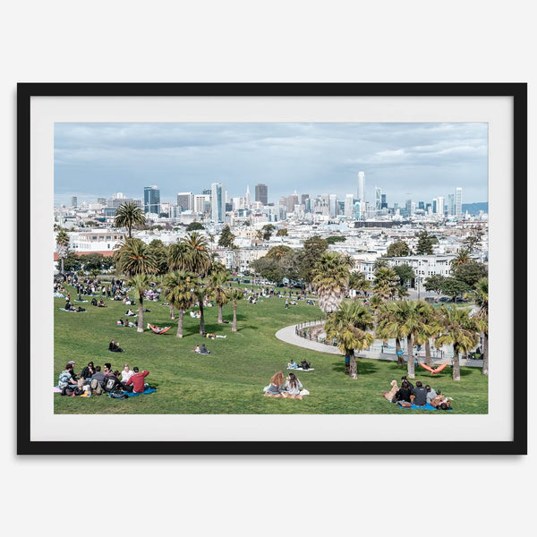 A fine art unframed or framed San Francisco print of Mission Dolores Park showcasing picnic blankets and people enjoying a quiet afternoon with the city skyline in the backdrop.