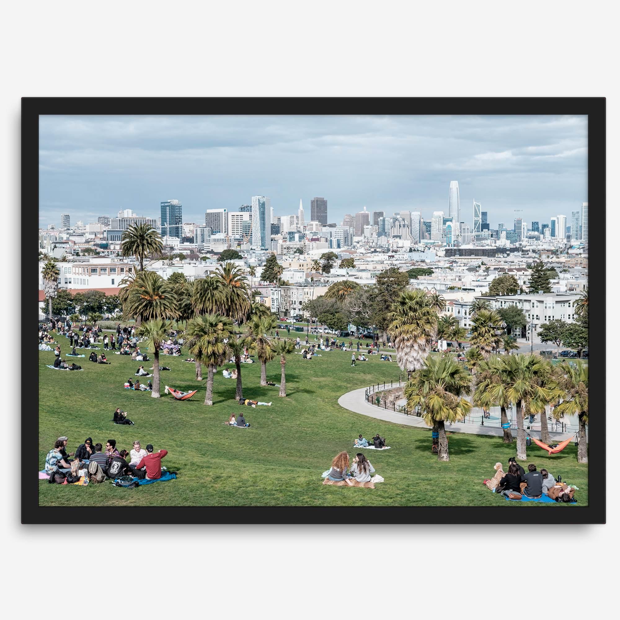 A fine art unframed or framed San Francisco print of Mission Dolores Park showcasing picnic blankets and people enjoying a quiet afternoon with the city skyline in the backdrop.