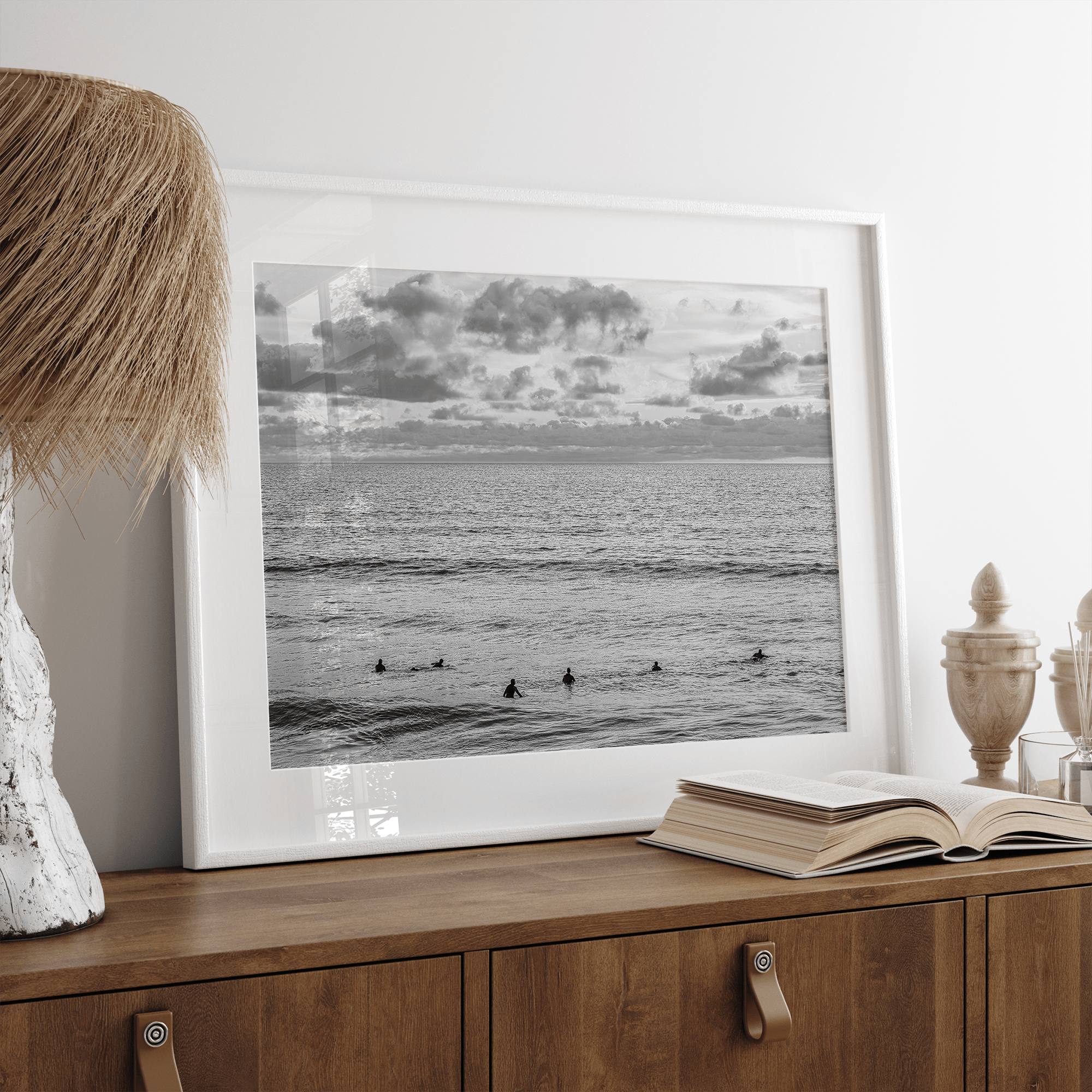 Black and white photo of surfers waiting in the water at sunset in Pismo Beach, California – fine art surf print.