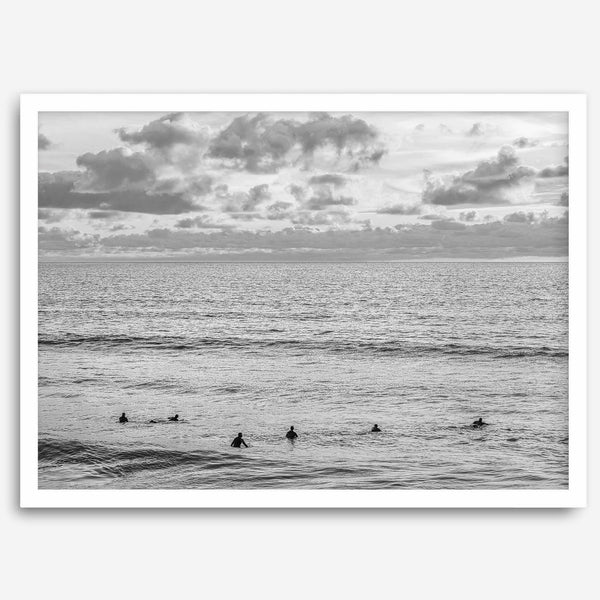 Black and white photo of surfers waiting in the water at sunset in Pismo Beach, California – fine art surf print.