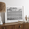 Black and white photo of surfers waiting in the water at sunset in Pismo Beach, California – fine art surf print.