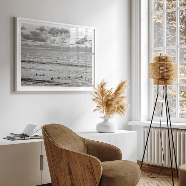 Black and white photo of surfers waiting in the water at sunset in Pismo Beach, California – fine art surf print.