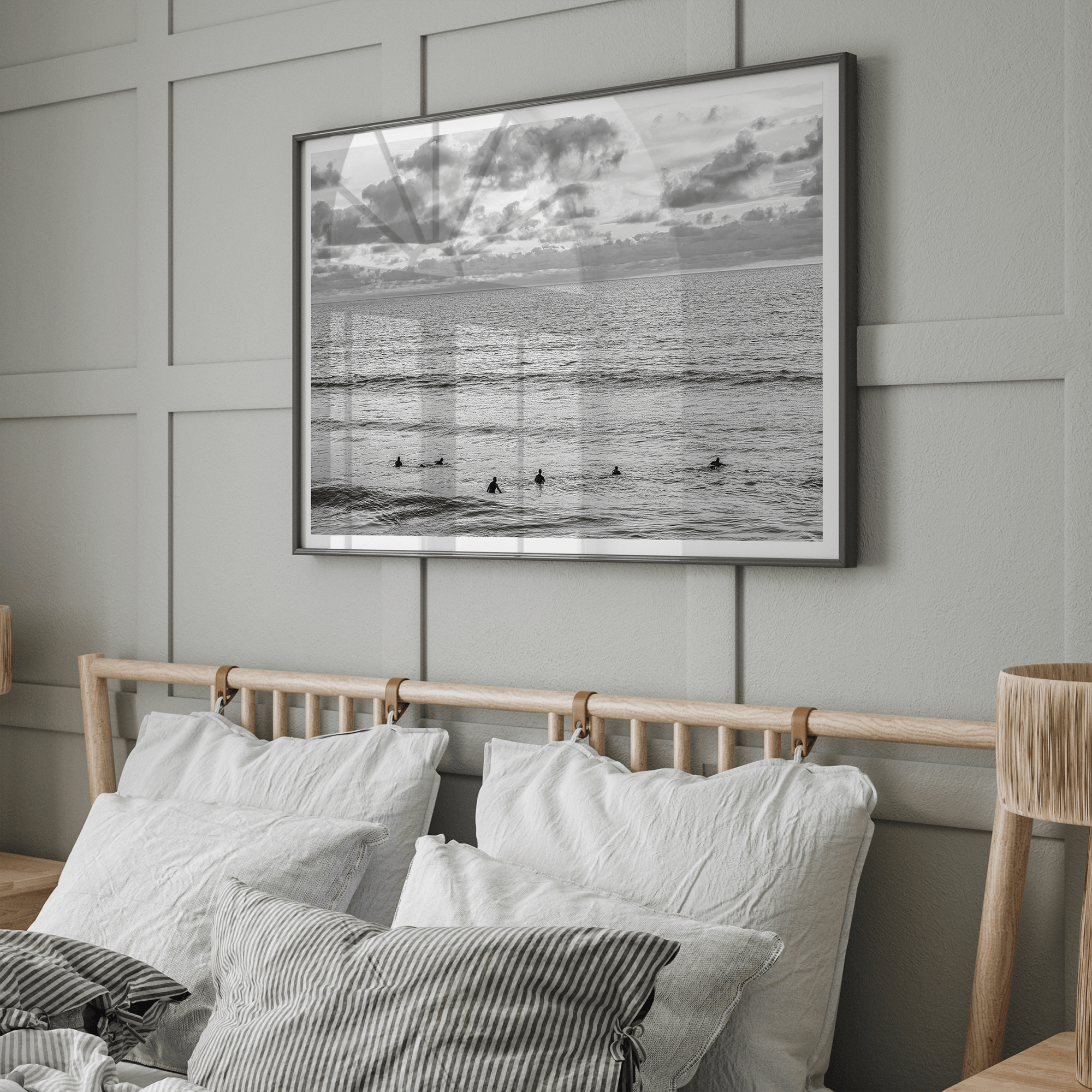 Black and white photo of surfers waiting in the water at sunset in Pismo Beach, California – fine art surf print.