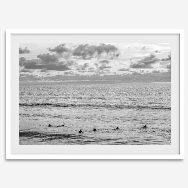 Black and white photo of surfers waiting in the water at sunset in Pismo Beach, California – fine art surf print.