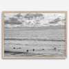 Black and white photo of surfers waiting in the water at sunset in Pismo Beach, California – fine art surf print.