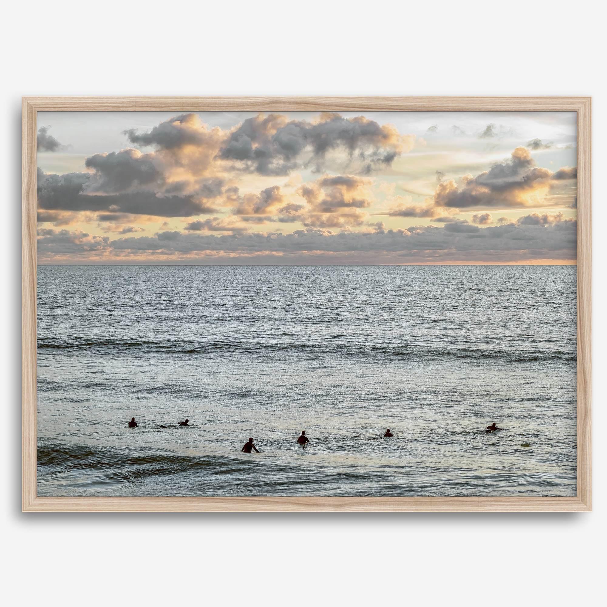 Sunset surf wall art featuring surfers’ silhouettes at Pismo Beach, California, with golden light, calm ocean, and vibrant sunset sky.