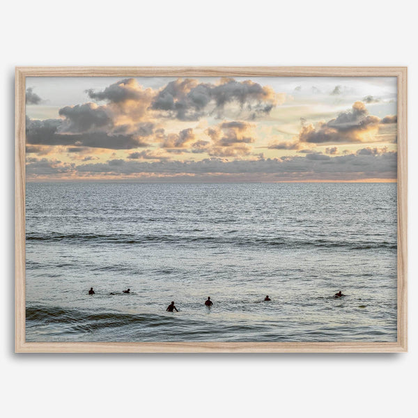 Sunset surf wall art featuring surfers’ silhouettes at Pismo Beach, California, with golden light, calm ocean, and vibrant sunset sky.