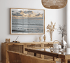 Sunset surf wall art featuring surfers’ silhouettes at Pismo Beach, California, with golden light, calm ocean, and vibrant sunset sky.