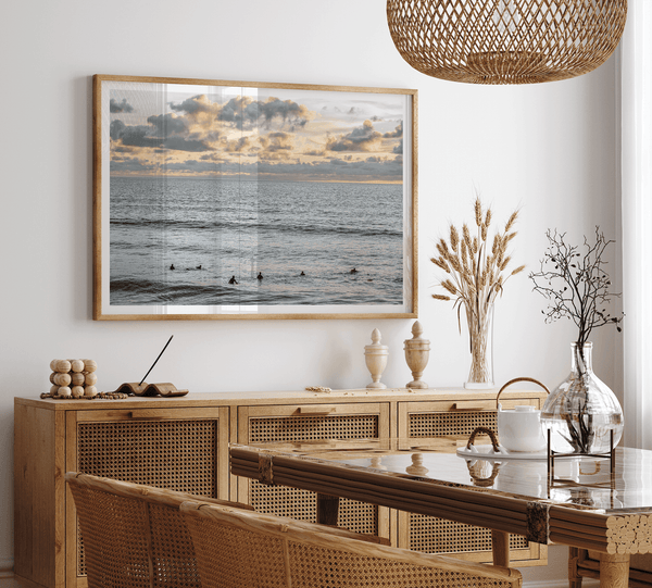 Sunset surf wall art featuring surfers’ silhouettes at Pismo Beach, California, with golden light, calm ocean, and vibrant sunset sky.