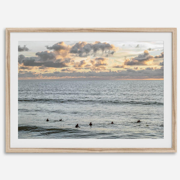 Sunset surf wall art featuring surfers’ silhouettes at Pismo Beach, California, with golden light, calm ocean, and vibrant sunset sky.