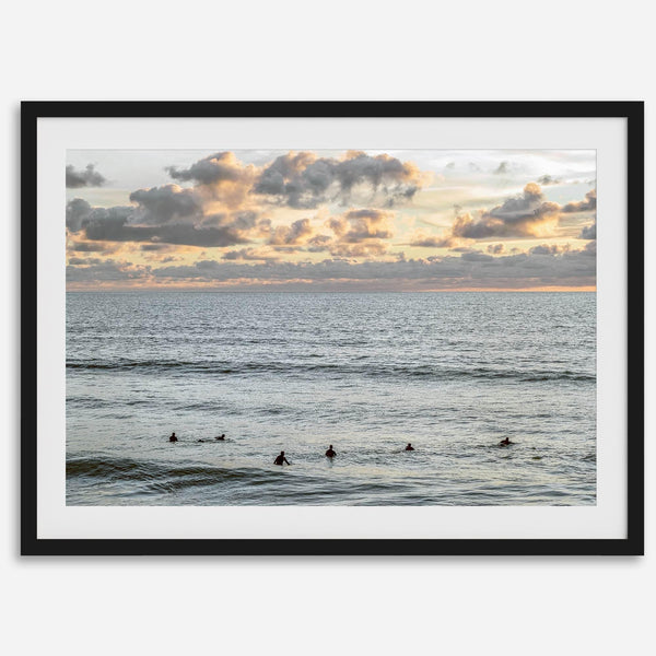 Sunset surf wall art featuring surfers’ silhouettes at Pismo Beach, California, with golden light, calm ocean, and vibrant sunset sky.