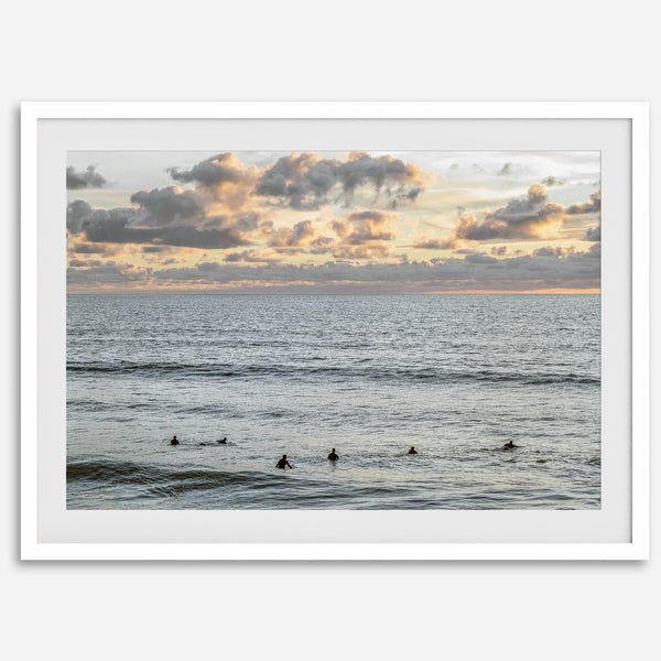 Sunset surf wall art featuring surfers’ silhouettes at Pismo Beach, California, with golden light, calm ocean, and vibrant sunset sky.