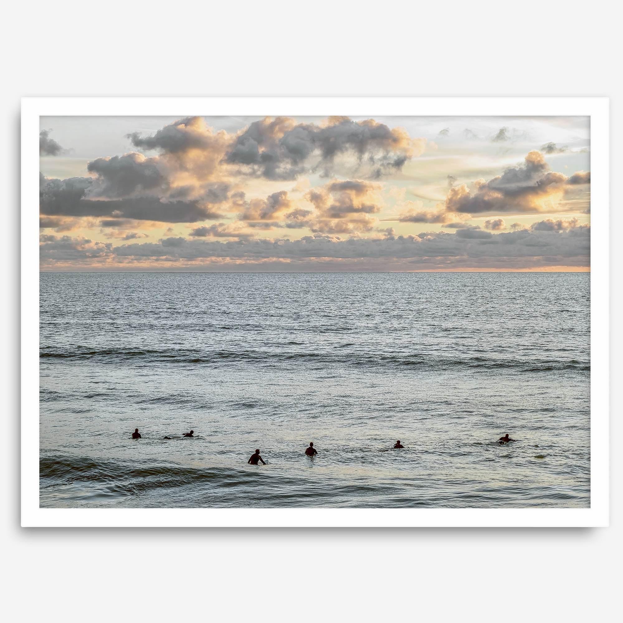Sunset surf wall art featuring surfers’ silhouettes at Pismo Beach, California, with golden light, calm ocean, and vibrant sunset sky.