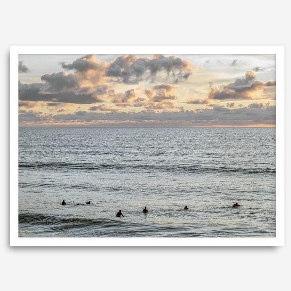 Sunset surf wall art featuring surfers’ silhouettes at Pismo Beach, California, with golden light, calm ocean, and vibrant sunset sky.