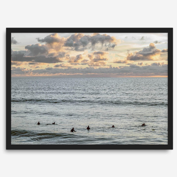 Sunset surf wall art featuring surfers’ silhouettes at Pismo Beach, California, with golden light, calm ocean, and vibrant sunset sky.