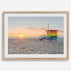 Venice Beach wall art featuring a colorful rainbow lifeguard tower beside the Pacific Ocean during a golden Los Angeles sunset.