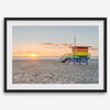 Venice Beach wall art featuring a colorful rainbow lifeguard tower beside the Pacific Ocean during a golden Los Angeles sunset.