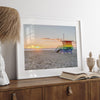 Venice Beach wall art featuring a colorful rainbow lifeguard tower beside the Pacific Ocean during a golden Los Angeles sunset.