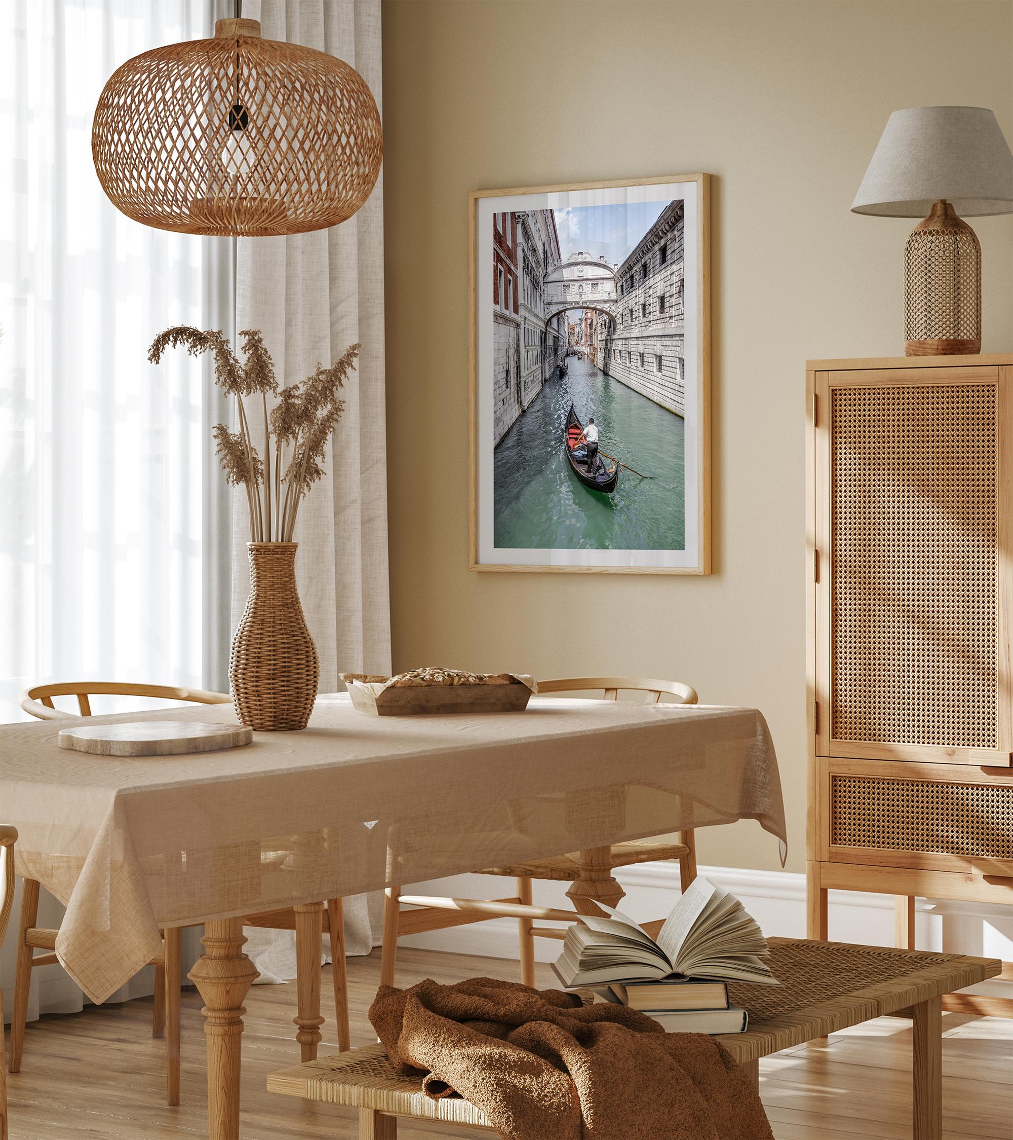 Venice canal photography print featuring a gondola approaching the Bridge of Sighs between historic stone buildings in Venice, Italy.