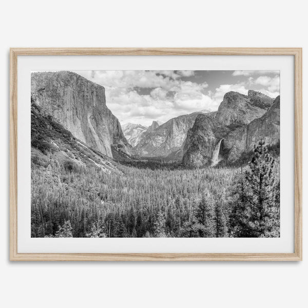 A breathtaking fine art black and white print of Yosemite valley during spring when the waterfalls are in full power.
