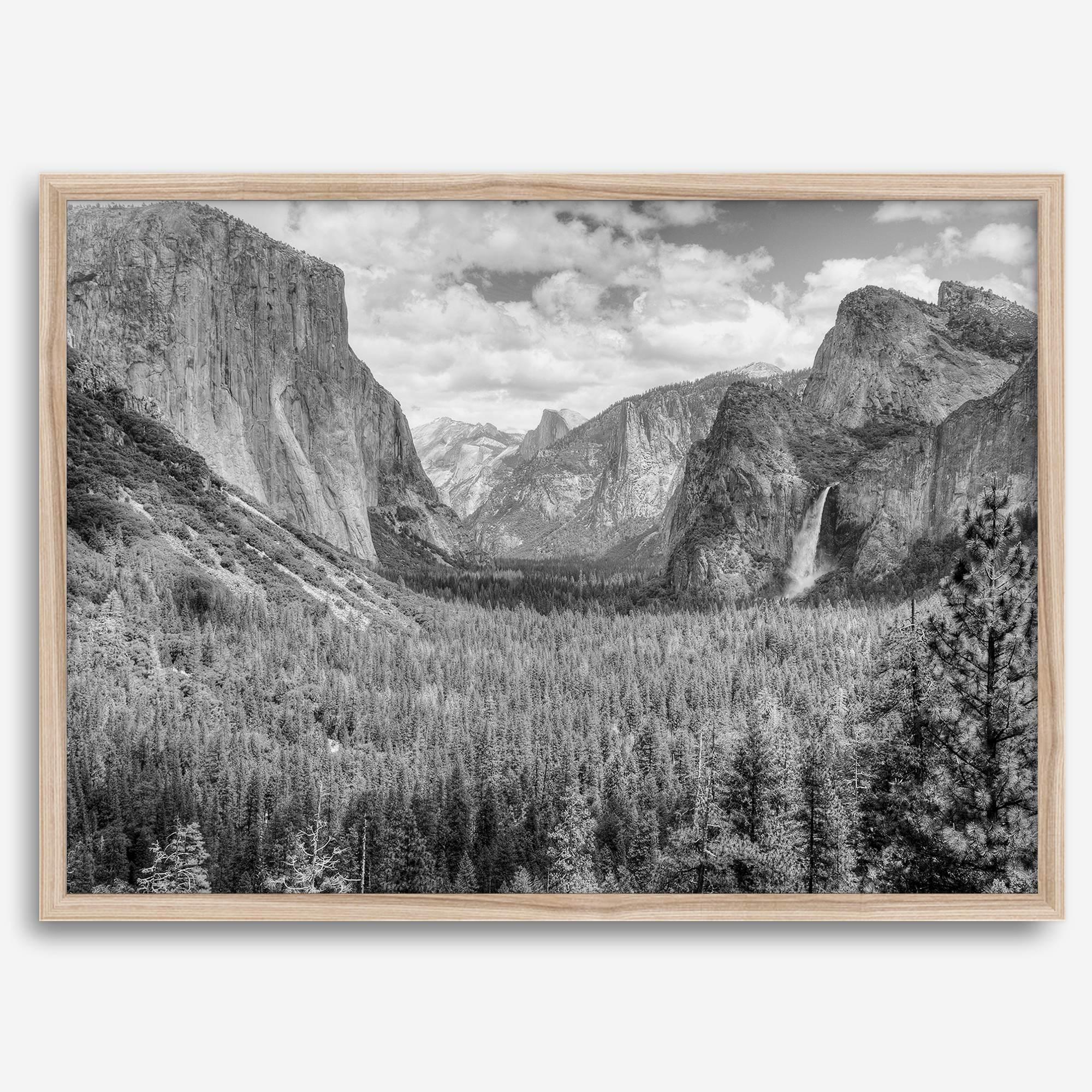 A breathtaking fine art black and white print of Yosemite valley during spring when the waterfalls are in full power.