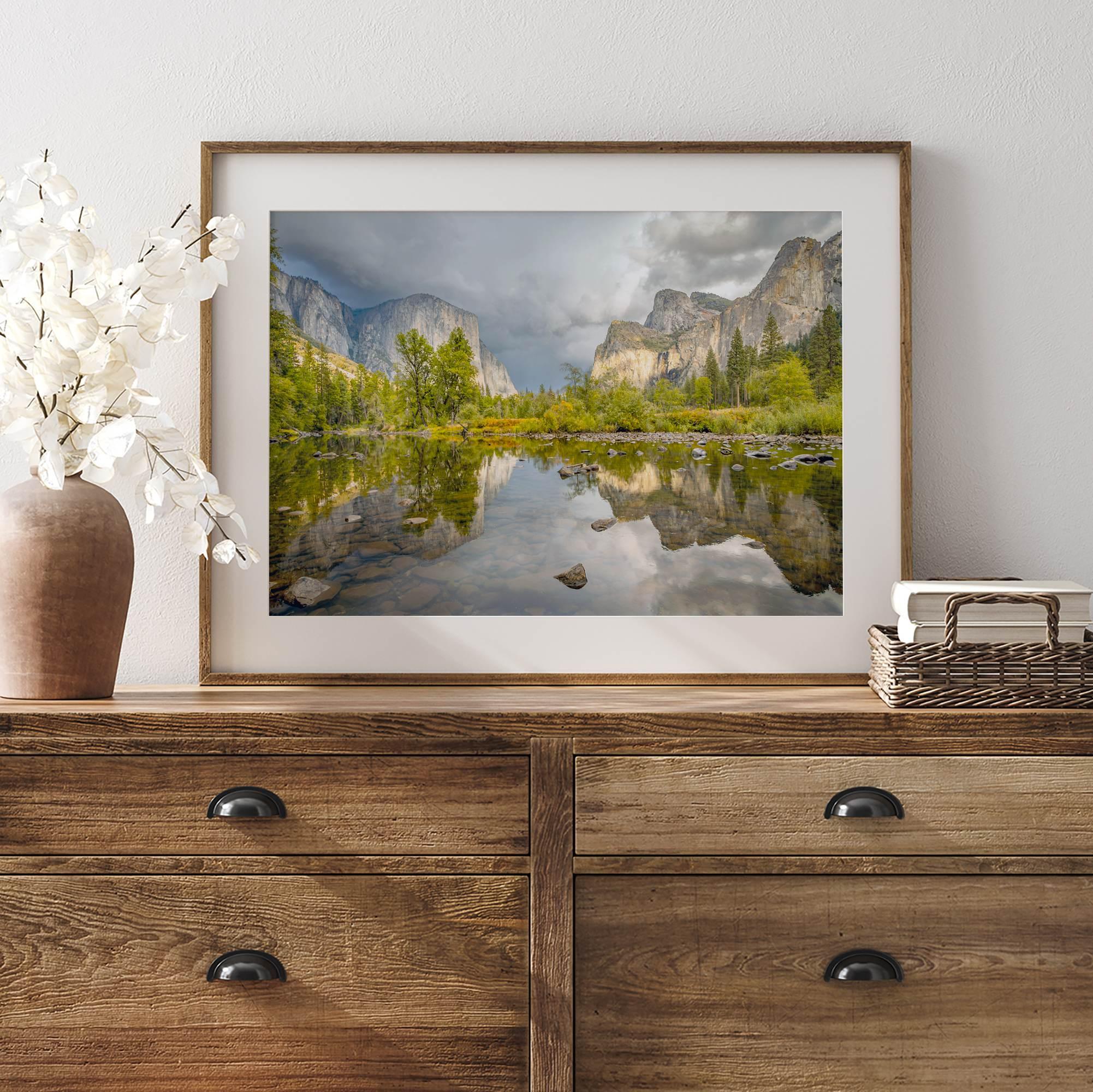 A stunning framed large Yosemite National Park print that shows the breathtaking valley at sunset with its mountains, rivers, forests, and waterfalls. A truly mesmerizing landscape that is as perfect as your wall decor as it is a special gift.