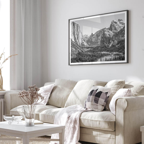 A fine art Yosemite Print featuring Yosemite Valley covered in snow in winter and a beautiful fog lays in the valley forest. This black and white mountain wall art is perfect for nature and fine art lovers.