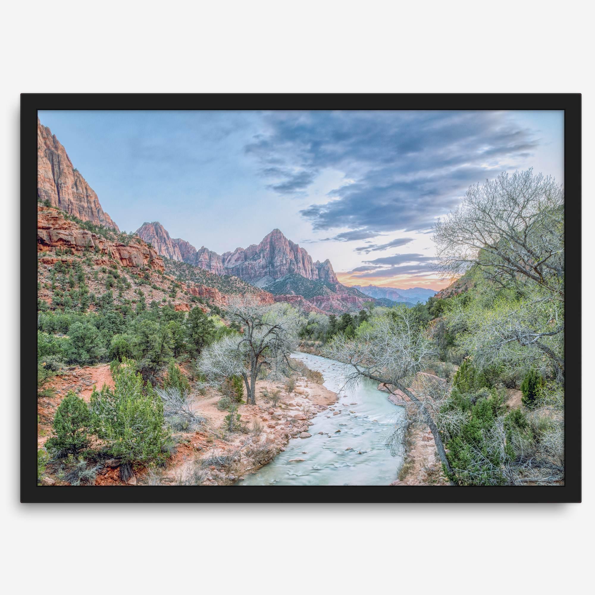 A framed fine art landscape photography print of Zion National Park showing a beautiful river, trees, and desert landscape with the backdrop of Zion mountain range. This Utah wall art is perfect for nature photography and desert art enthusiasts.