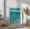 A fine art aerial ocean photography print showing surfers paddling for waves. Stunning blue wall art for home decor. 