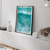 A fine art aerial ocean photography print showing surfers paddling for waves. Stunning blue wall art for home decor. 
