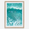 A fine art aerial ocean photography print showing surfers paddling for waves. Stunning blue wall art for home decor. 