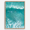 A fine art aerial ocean photography print showing surfers paddling for waves. Stunning blue wall art for home decor. 