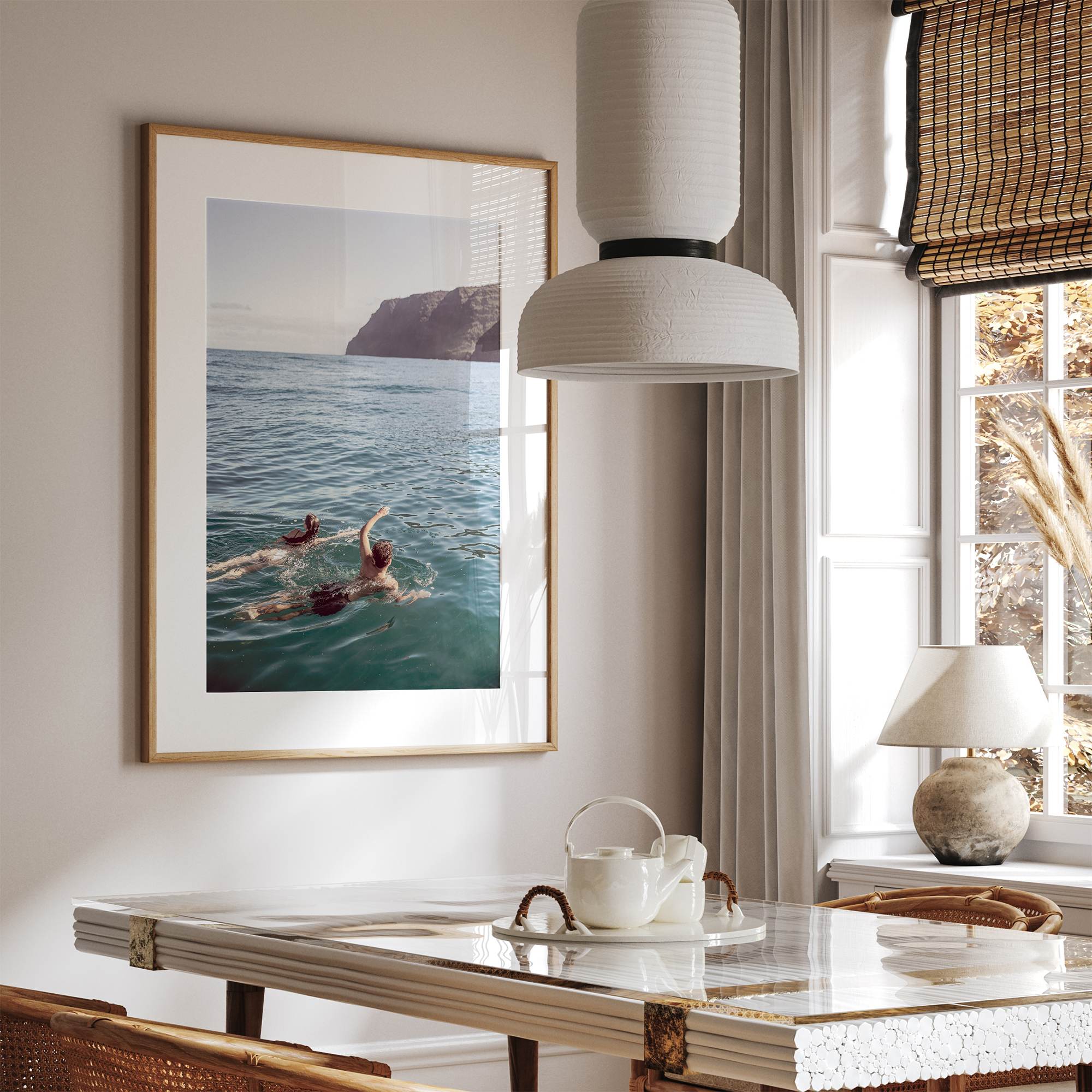 Summer wall art of a coastal Hawaiian landscape with figures swimming in deep blue ocean water.