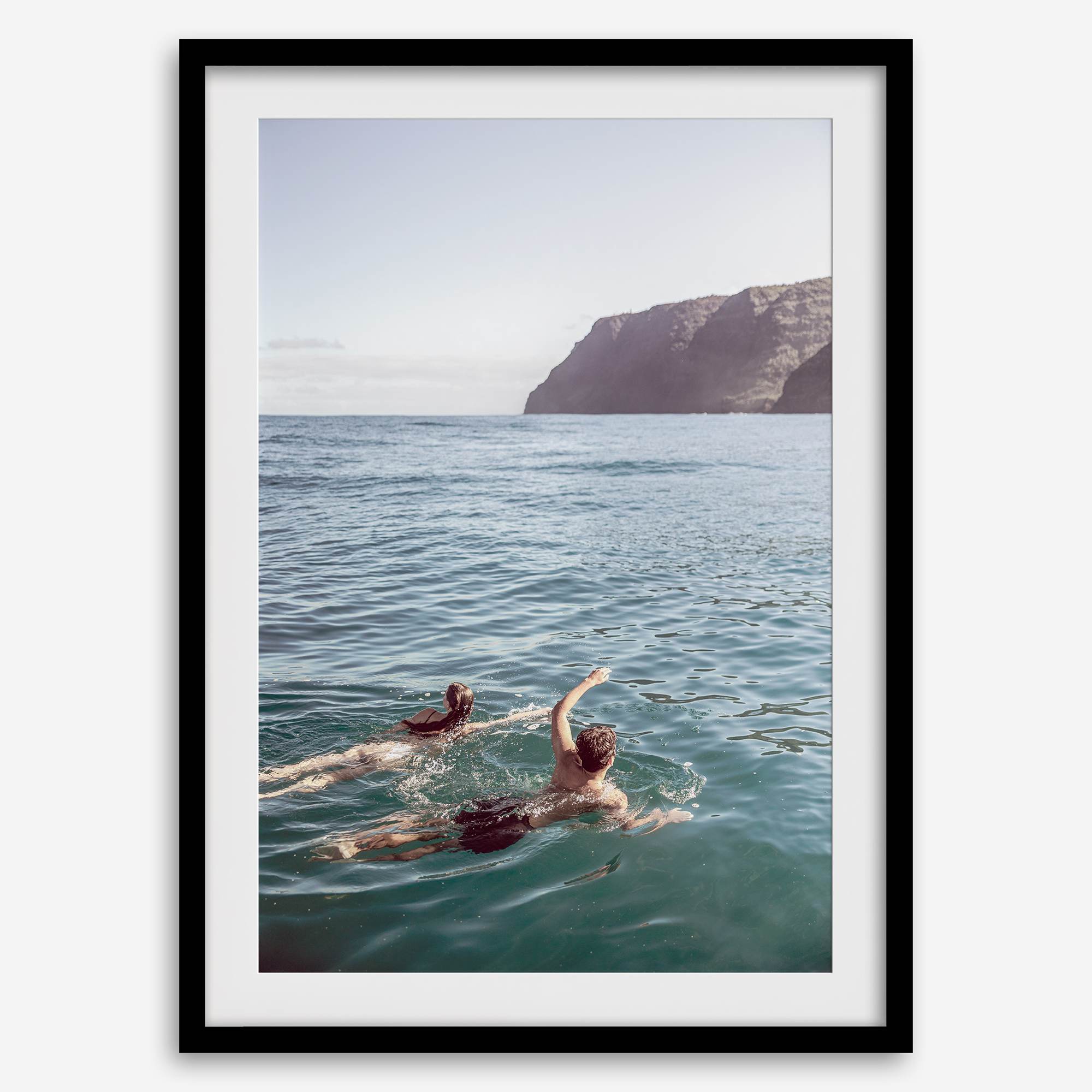 Summer wall art of a coastal Hawaiian landscape with figures swimming in deep blue ocean water.