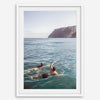Summer wall art of a coastal Hawaiian landscape with figures swimming in deep blue ocean water.