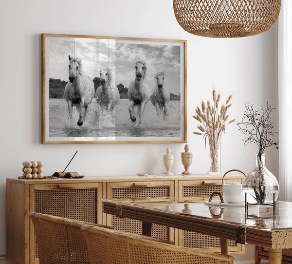 Running horses wall art in black and white featuring Camargue horses splashing through coastal waters near Saintes-Maries-de-la-Mer