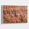  Large framed Bryce Canyon wall art featuring towering orange sandstone hoodoos and intricate rock formations in Bryce Canyon National Park, Utah.