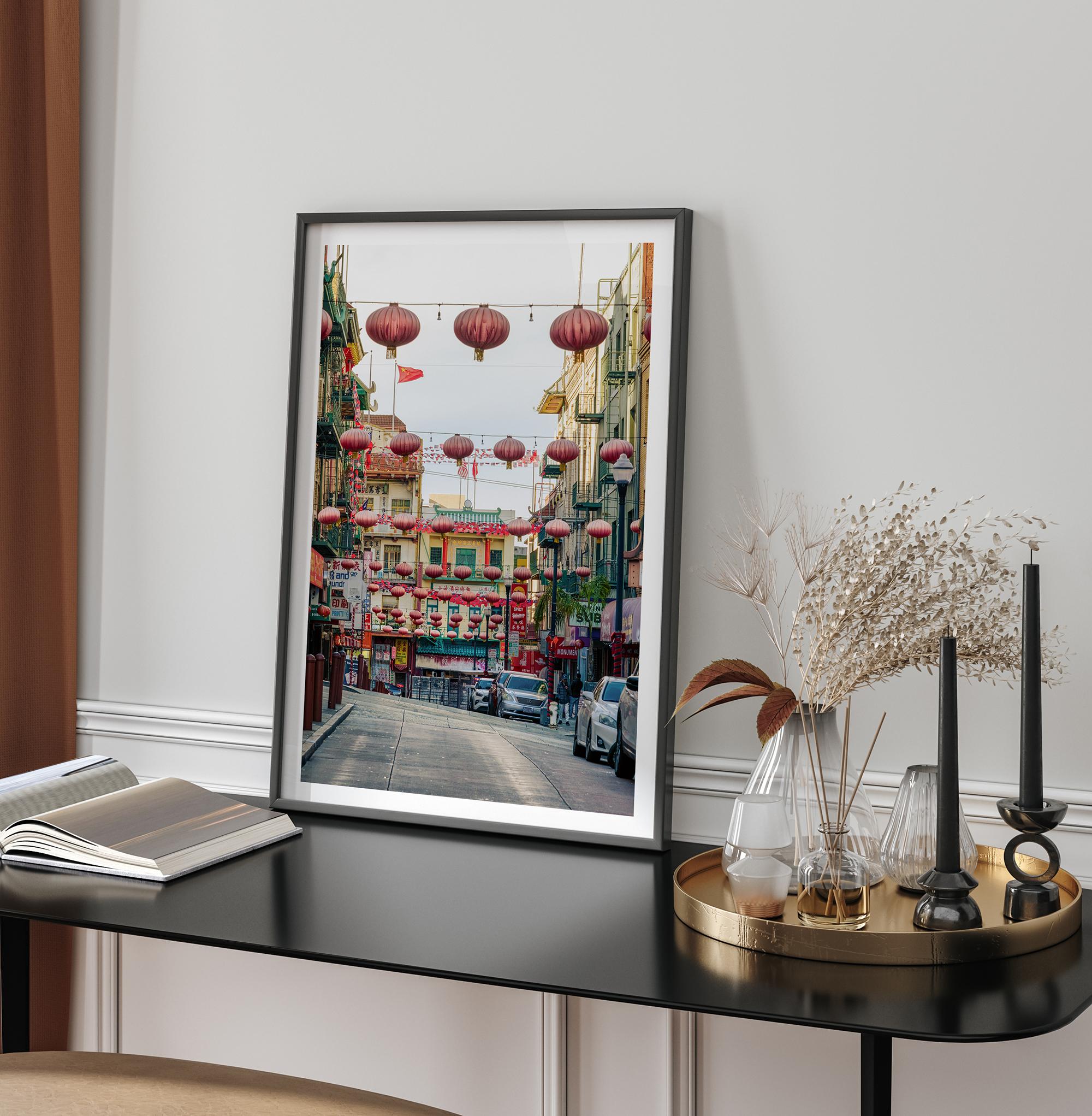Chinatown Photography framed or unframed print showing red lanterns above a colorful San Francisco Chinatown street with shops and historic architecture.
