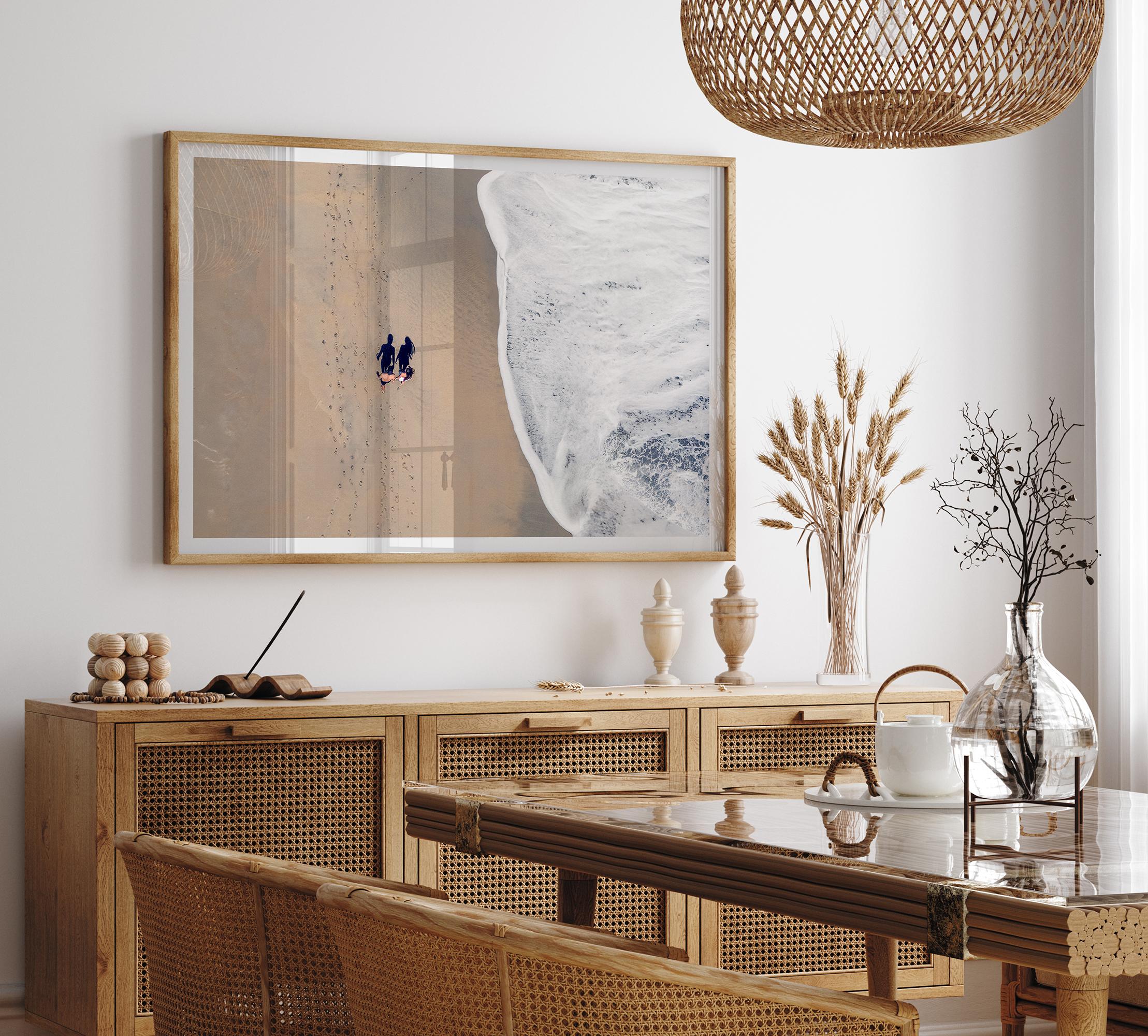 Aerial beach photograph of a couple beside Pacific Ocean waves in Capitola, California, styled as romantic coastal bedroom wall art.