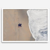 Aerial beach photograph of a couple beside Pacific Ocean waves in Capitola, California, styled as romantic coastal bedroom wall art.