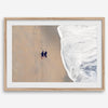 Aerial beach photograph of a couple beside Pacific Ocean waves in Capitola, California, styled as romantic coastal bedroom wall art.