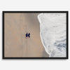 Aerial beach photograph of a couple beside Pacific Ocean waves in Capitola, California, styled as romantic coastal bedroom wall art.