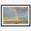Desert landscape artwork of a rainbow over Arizona sand dunes with distant mountains.