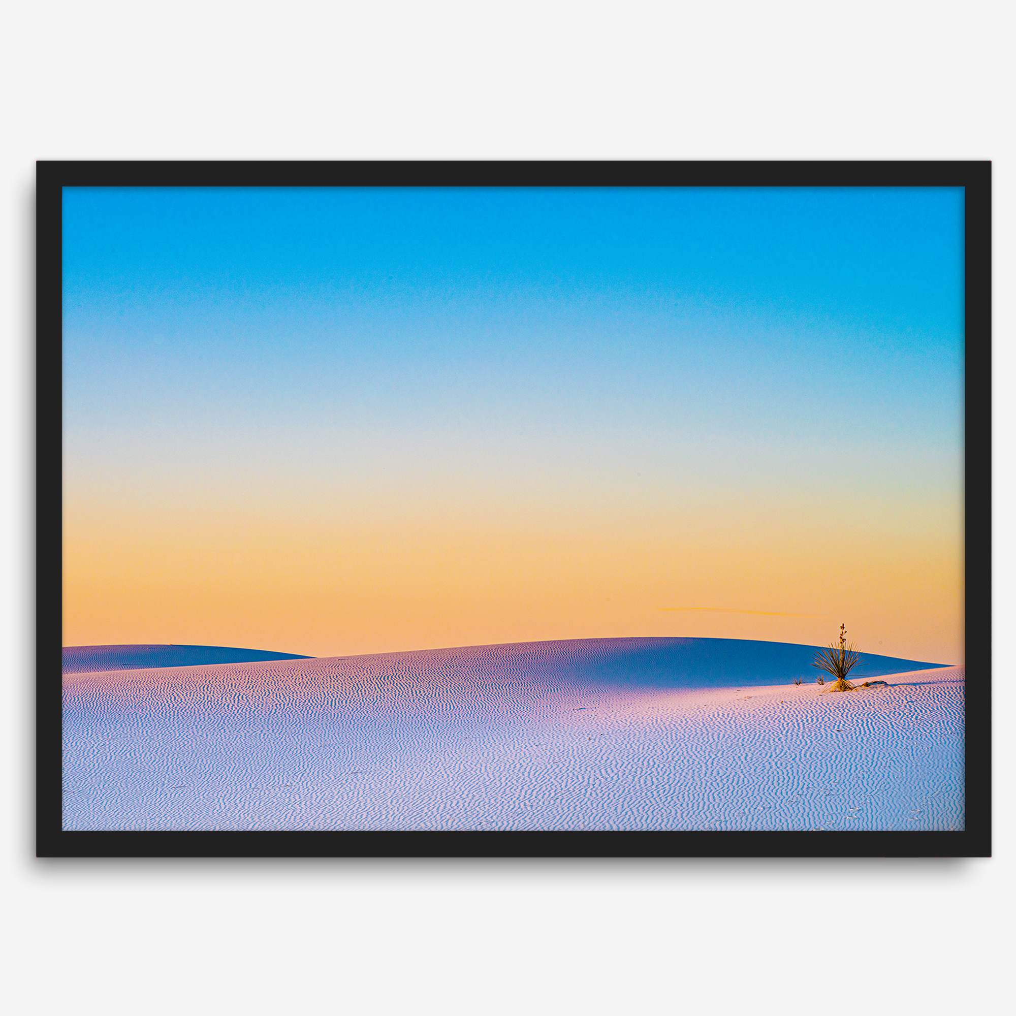 Panoramic desert landscape photography print showing White Sands National Park at sunset with blue sky and golden horizon.