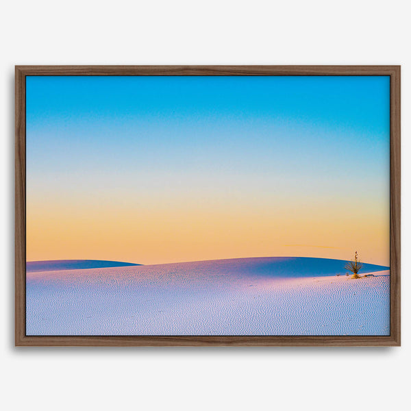 Panoramic desert landscape photography print showing White Sands National Park at sunset with blue sky and golden horizon.