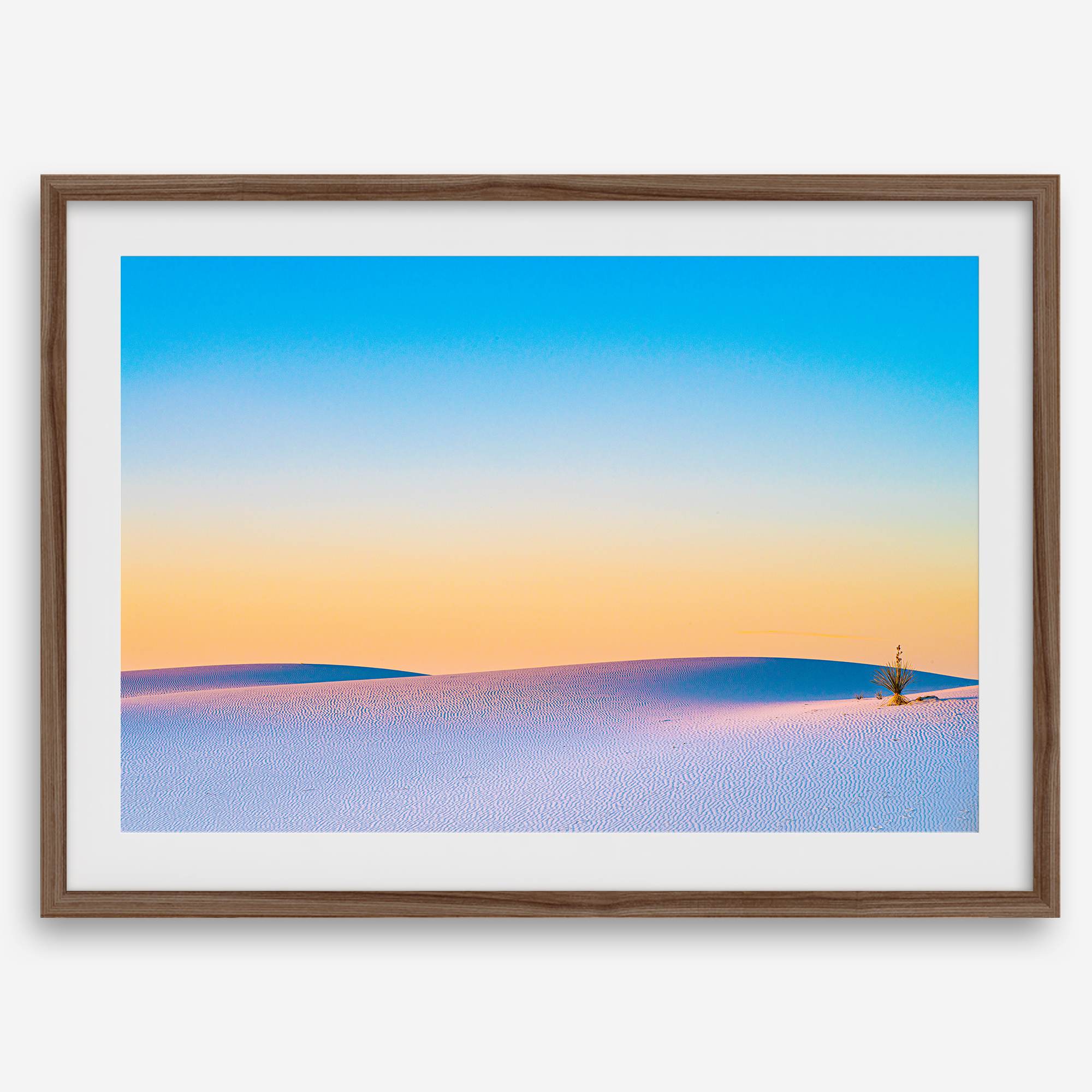 Panoramic desert landscape photography print showing White Sands National Park at sunset with blue sky and golden horizon.